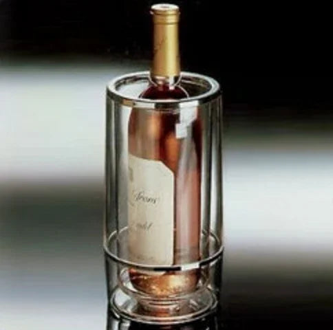 Wine bottle in clear glass wine cooler on black reflective surface